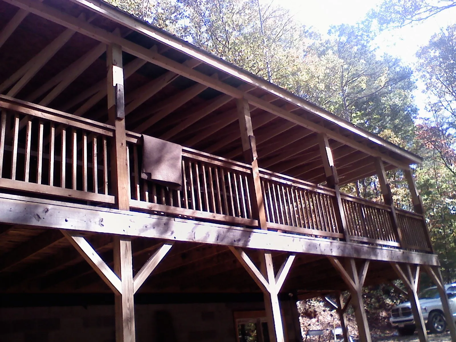 Timber framing under a new elevated porch and deck — Roof Leak Repair in Midland by Roofing Brothers